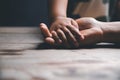 Christian family praying together concept. Child and mother worship God in home. Woman and boy hands praying to god with the bible Royalty Free Stock Photo