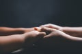 Christian family praying together concept. Child and mother worship God in home. Woman and boy hands praying to god with the bible Royalty Free Stock Photo