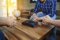 Christian friends prays together surrounded wooden table Royalty Free Stock Photo