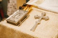 Christian cross, Bible, bottles of oil on a Golden cloth in the Church Royalty Free Stock Photo