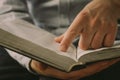 The Christian holds the Bible in his hands. Reading the bible. The concept of faith