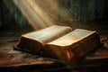 Christian Holy Bible Book that is open with golden rays of light falling from top Royalty Free Stock Photo