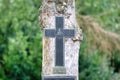Christian IHS monogram on a stone cross