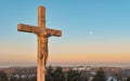 Christian image of Jesus crucifixion on the cross on a hillside cemetery. Royalty Free Stock Photo