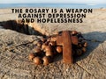 Christian inspirational quote - The rosary is a weapon against depression and hopelessness. With wooden rosary with Jesus Christ.