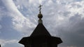 Christian orthodox church building with cross on roof top under cloudy sky low angle shot. Media. Religious place Royalty Free Stock Photo