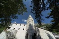 Christian Orthodox church,framed by fir tree branches,below Ostrog Monastery,Central Montenegro Royalty Free Stock Photo