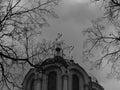 Christian orthodox cross on the church dome and gray white sky and clouds Royalty Free Stock Photo