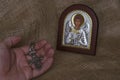 Christian orthodox icon of the Archangel Michael and a hand with a silver cross Royalty Free Stock Photo