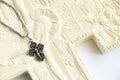 Christian plaster cross and silver cross on chains on a white background close-up, love of god