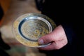 A Christian priest holds in his hands a wedding ring. Royalty Free Stock Photo