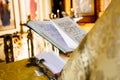 Christian priest reading church book, priest reads a pray over the Bible Royalty Free Stock Photo