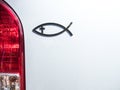 Christian religious Fish sign on rear of white car Royalty Free Stock Photo