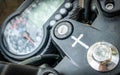 Motorbike with crucifix symbol near ignition key slot,Mysuru,Karnataka,India Royalty Free Stock Photo