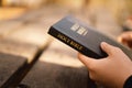 Christian teen girl holds bible in her hands. Reading the Holy Bible. Concept for faith