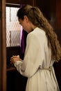 Christian woman, church and confessional, worship and prayer for forgiveness, mercy and peace to holy God, praying and