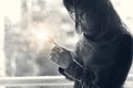 Christian woman with cross in hands praying hope and worship on the raindrop background. Abstract lighting. Eucharist therapy bles Royalty Free Stock Photo