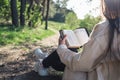 Christian woman holds bible in her hands. Reading the Bible in nature. Concept for faith, spirituality and religion