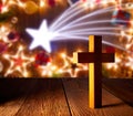 Christian wood cross on Christmas stars Royalty Free Stock Photo