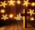 Christian wood cross on Christmas stars Royalty Free Stock Photo