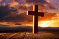 Christian wood cross on sunset sky