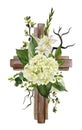 Christian wooden cross decorated with white hydrangea and leaves Royalty Free Stock Photo