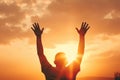 Christian Worship And Praise Concept Hands Rising Against Sunset Background