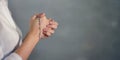 Cross rosary in woman hands praying for god blessing Royalty Free Stock Photo