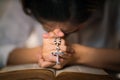 Osary of jesus cross in hands of woman praying for god blessing Royalty Free Stock Photo