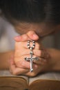 Osary of jesus cross in hands of woman praying for god blessing Royalty Free Stock Photo