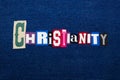 CHRISTIANITY word text collage, multi colored fabric on blue denim, Christianity religion diversity concept