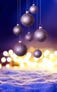 Christmas abstract background with violet glittening balls and Christmas lights on snow Royalty Free Stock Photo