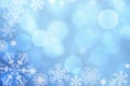 Christmas abstract winter shiny snow bokeh background with unique snowflakes Royalty Free Stock Photo