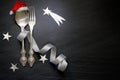Christmas abstract table with silver cutlery and stars in night on marble black background Royalty Free Stock Photo