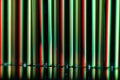 Abstract: Vertical Streaks of Red and Green Light Forming a Holiday Background