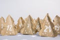 Handmade Christmas advent calendar Christmas trees Kraft paper with numbers.