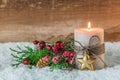 Christmas or Advent decoration with candle and snow Royalty Free Stock Photo