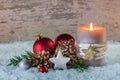 Christmas or Advent decoration with candle and snow