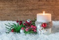 Christmas or Advent decoration with candle and snow Royalty Free Stock Photo