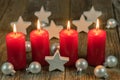 Advent and Christmas candles with stars and balls decoration Royalty Free Stock Photo