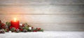 Christmas or Advent wood background with a candle Royalty Free Stock Photo