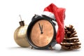 Christmas Alarm Clock in hat of Santa Claus with pine cone and decoration ball. 3D Rendering