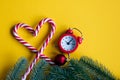 Christmas alarm clock and lolipop Royalty Free Stock Photo
