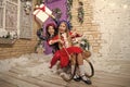 Christmas is already here. Girl sledding with christmas gift box. Small cute girls received holiday gifts. Kids little