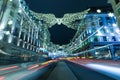 Christmas angel and decoration lights in Regent Street London. UK. Shot from the lower end of Regent street at night in December