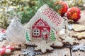 Christmas angel and a gingerbread house. Royalty Free Stock Photo