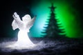 Christmas Angel glass xmas figure and glass fir tree, christmas tree, docorative elements on dark background. Christmas decoration Royalty Free Stock Photo