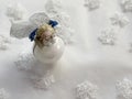 Christmas angel toy across white background with snowflakes. Christmas concept Royalty Free Stock Photo