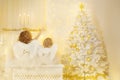 Christmas Angels looking to Xmas Tree, Children Wings on Back Royalty Free Stock Photo
