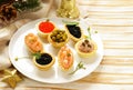 Christmas appetizers. Small tartlets with caviar and pate.